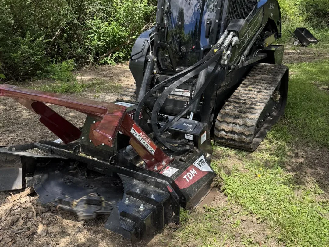 The track loader and Virnig mulcher head that cleared the lot